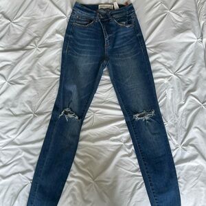 Skinny ripped knee jeans
